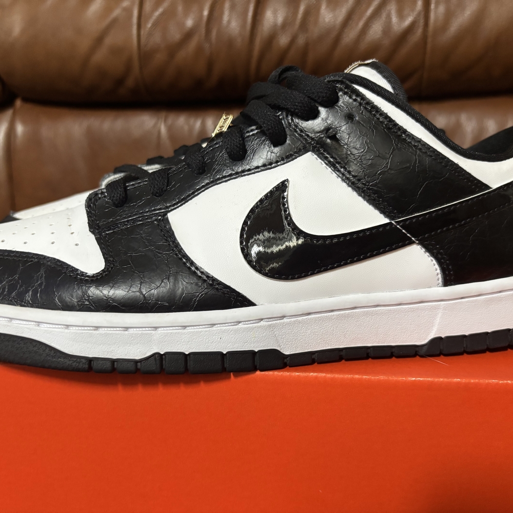 Nike Black and White Sneakers with Gold Accents - Picture 4 of 5